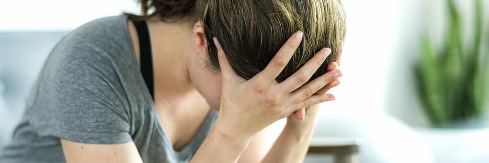 woman with face in her hands